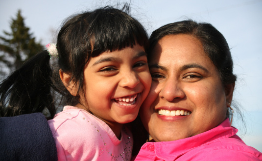 Photo of woman and child smiling