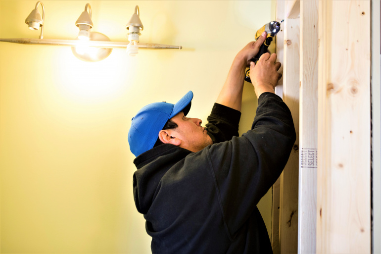 Contractor doing work on public housing unit