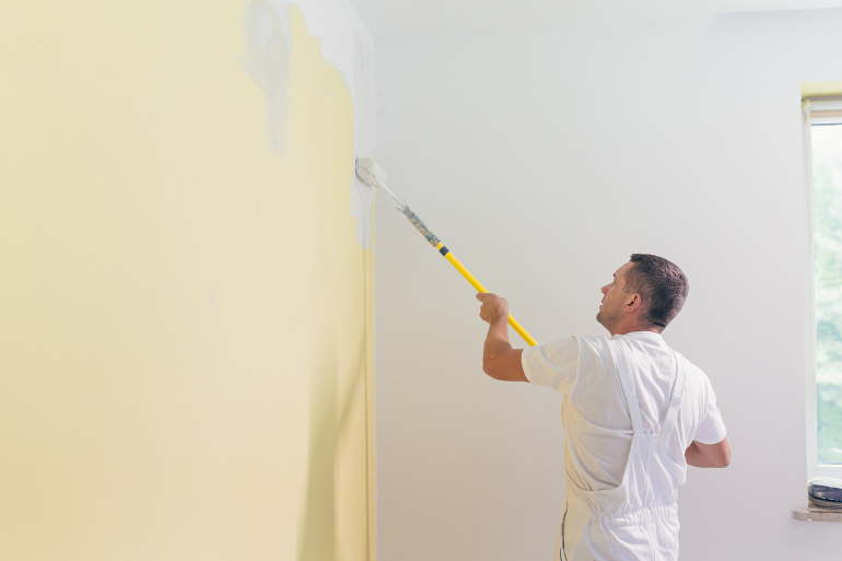 Man painting wall